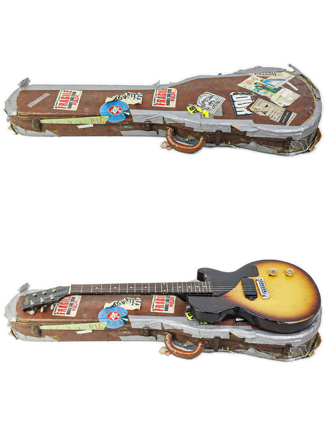  Display of two guitars, including a 1958 Gibson Les Paul Jr in TV Yellow, one secured in a case and the other visible.