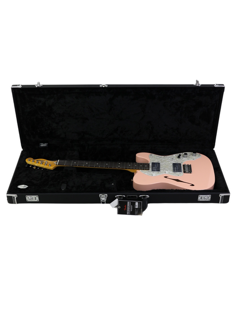 Electric bass guitar in pink with case on white background.