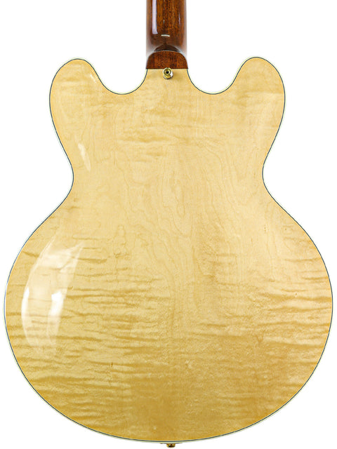 Elegant Gibson Custom Shop ES-355 guitar from 2011, featuring a white body and a beautifully crafted wooden back.