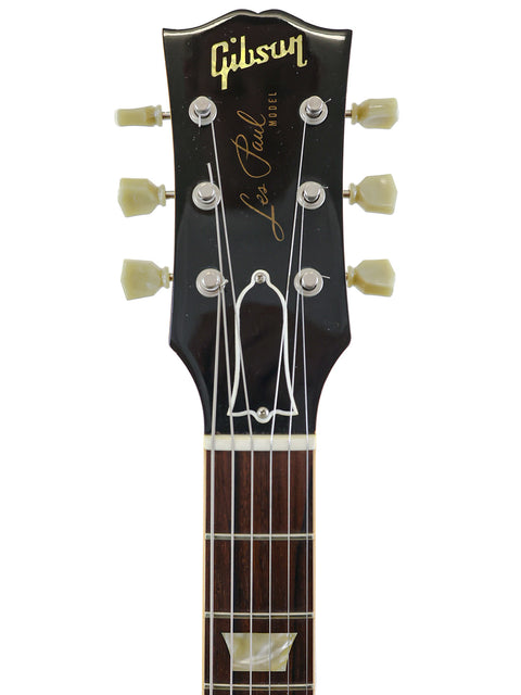 Elegant black Gibson Les Paul Classic guitar, representing the craftsmanship of the 2004 Custom Shop 1959 Reissue model.