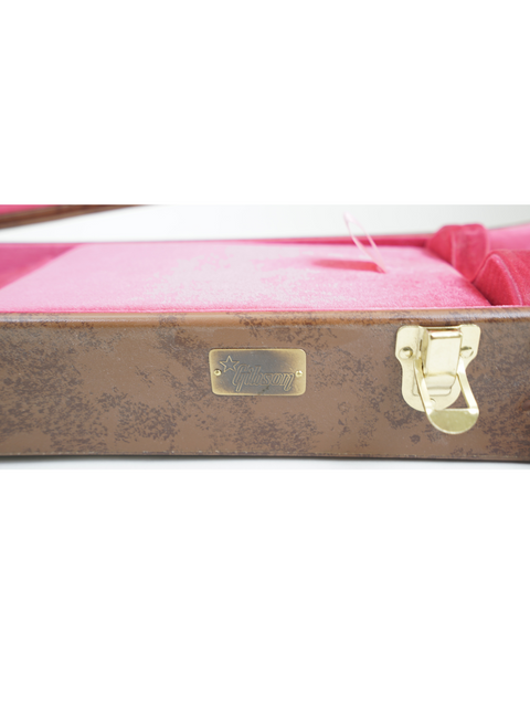Elegant pink and brown suitcase featuring a gold handle, ideal for your Gibson Lifton 5-Latch guitar case needs.