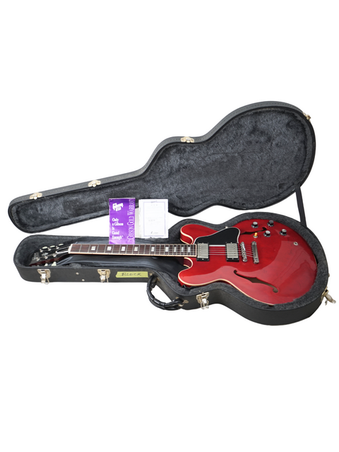 Eye-catching red electric guitar in a case, ideal for serious players wanting the classic Gibson ES-335 sound.