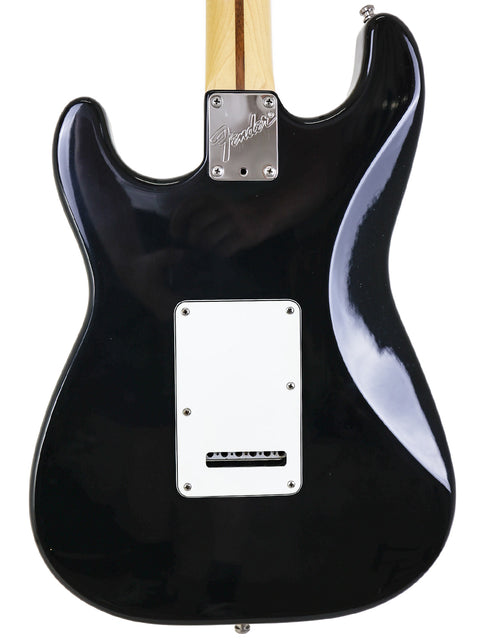 Fender American Standard Stratocaster in black, model Strat Plus from 1991, highlighting its iconic shape and features.