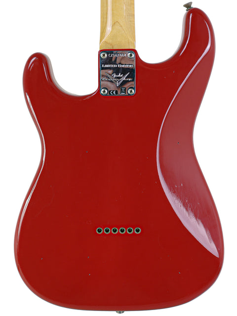 Fender Custom Shop 1961 Stratocaster in Dakota Red, featuring a wooden body and neck, exemplifying craftsmanship.