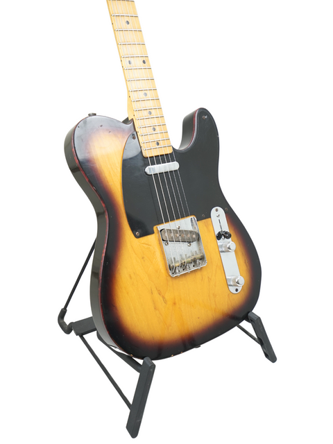 Fender Custom Shop 50's Telecaster NOS from 2012, showcasing a black body with a beautiful sunburst finish.