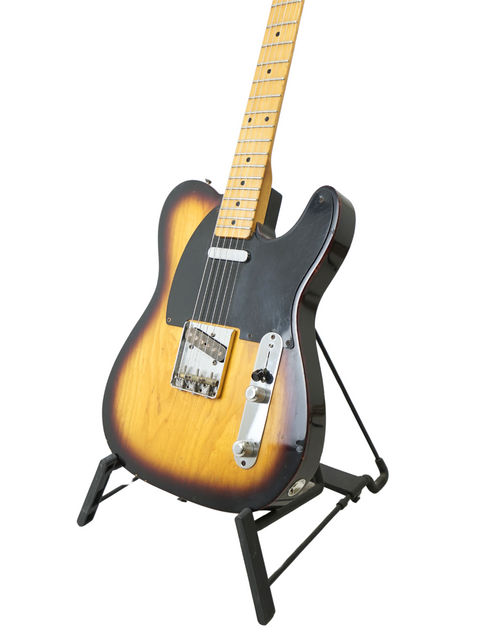 Fender Custom Shop 50's Telecaster NOS from 2012, showcasing a black body with a vibrant sunburst finish.