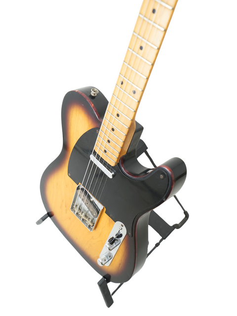 Fender Custom Shop 50's Telecaster NOS guitar with a sleek black body and vibrant sunburst finish, USA 2012 model.
