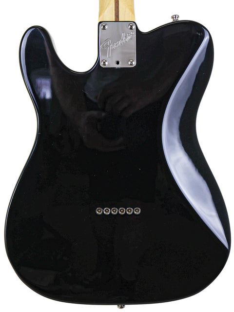 Fender Tele Plus V2 electric guitar, black finish with a wooden body, crafted in the USA in 1999.