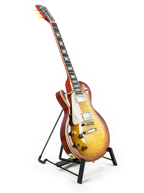 Gibson Custom Shop LPR-8 left-handed guitar displayed on a stand, set against a pristine white backdrop for a striking look.