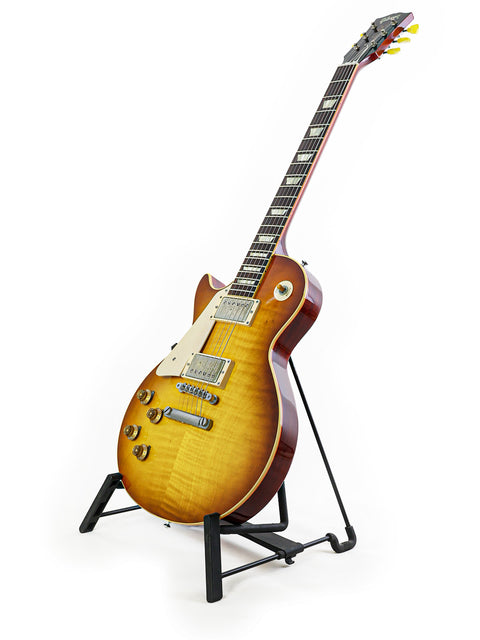 Gibson Custom Shop LPR-8 left-handed guitar elegantly positioned on a stand with a minimalist white background.
