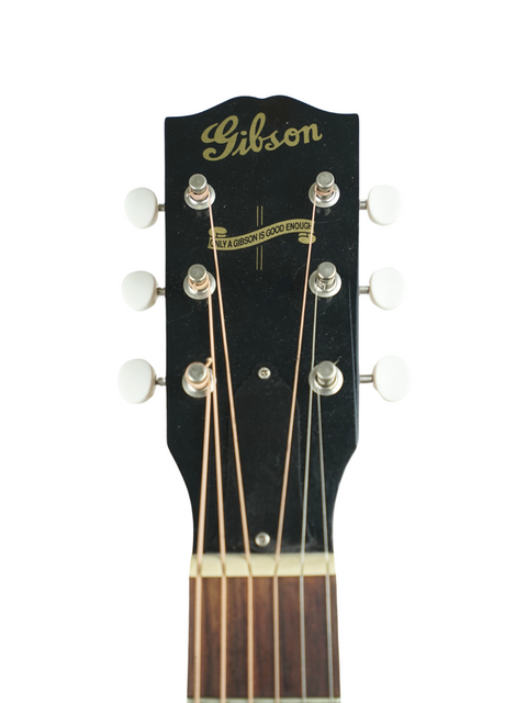 Gibson Les Paul Custom 1964 guitar, showcasing its classic design and craftsmanship, alongside a Gibson J-35 from 2013.