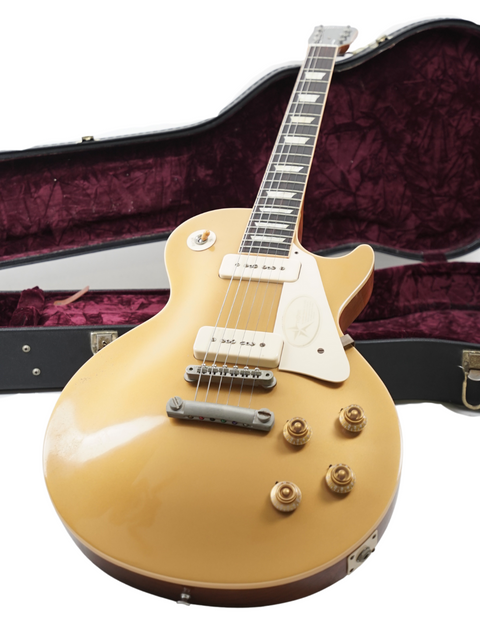 Gold guitar in a case on a white background, showcasing the Gibson Custom Historic VOS LPR-6 1956 Reissue Gold Top.