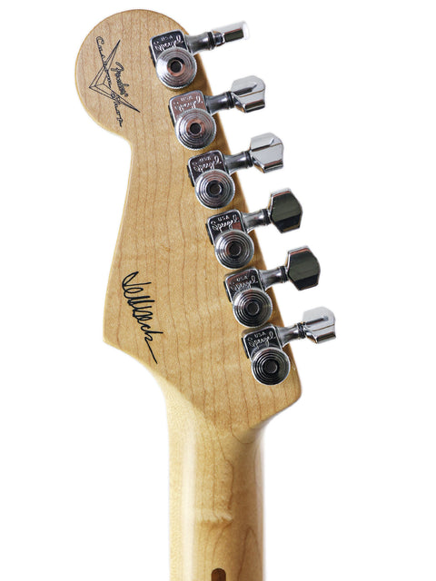 Headstock close-up of a 2008 Fender Custom Shop Jeff Beck Signature Stratocaster, showcasing its craftsmanship.