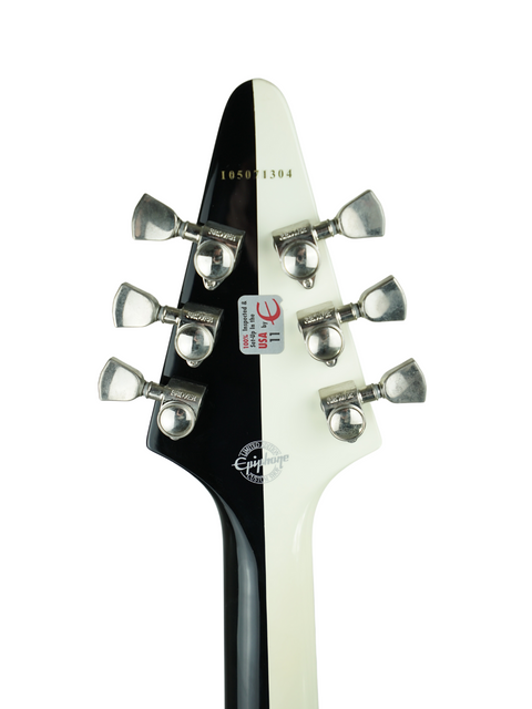 Headstock of a black and white guitar with tuning pegs and a logo visible.