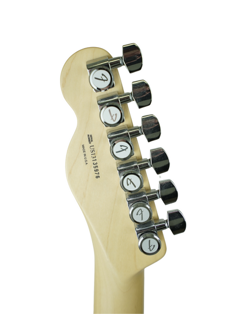 Headstock of a guitar with tuning pegs and a serial number against a white background.