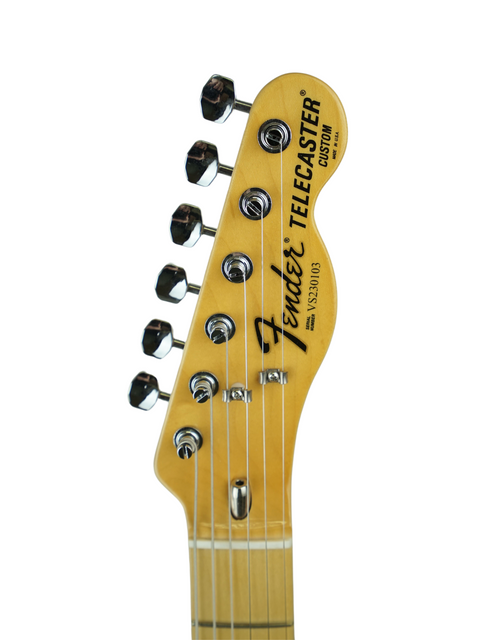 Headstock of a yellow Fender Telecaster with tuning pegs, isolated on white background.