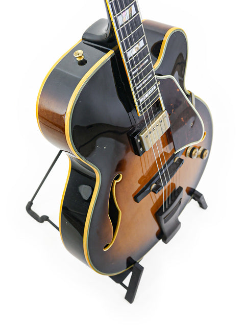 Ibanez JP20 guitar featuring a sleek black body and vibrant yellow neck, a classic model from Japan, 1982.