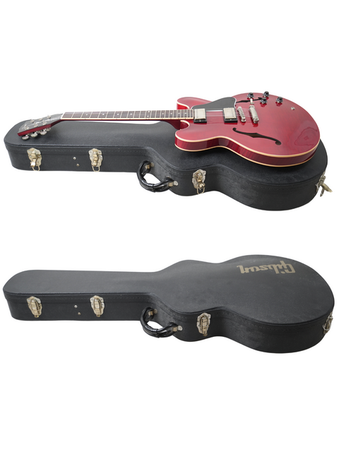 Image of two guitars with cases on a white background, showcasing a 2006 USA Gibson ES-335 Dot.
