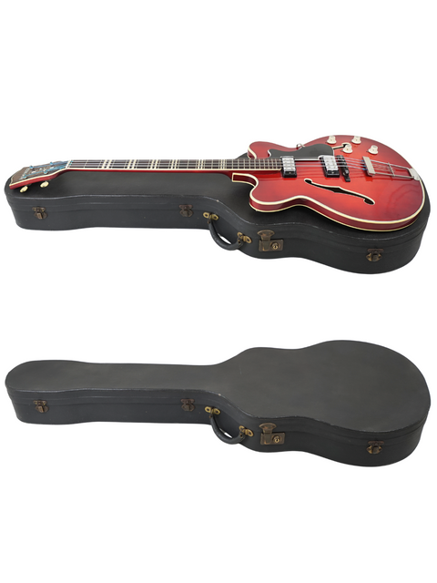Inside a black case, two guitars are displayed, one being a vintage red Hofner Verithin Bass from Germany, 1961.
