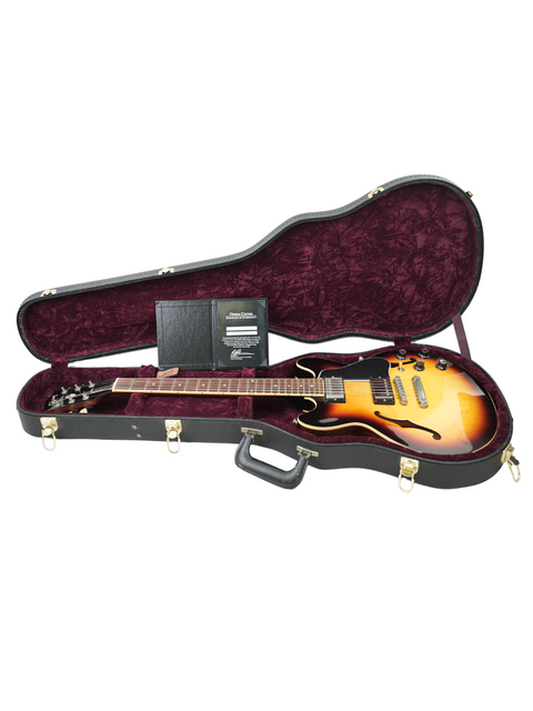 Inside a guitar case, a Gibson Custom Shop ES-339 Memphis from 2009 rests, highlighting its craftsmanship and style.