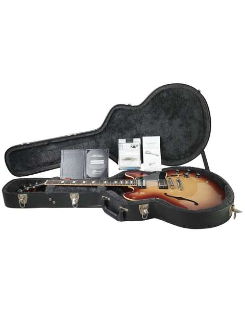 Inside a guitar case lies a Gibson Custom ES-335 Iced Tea, a stunning instrument from the USA, crafted in 2012.