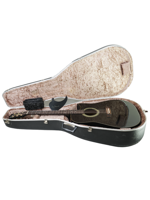 Inside a sleek black case lies a vintage Maton Tommy Emmanuel 'Ebony' Signature guitar from 1989, ready to play.
