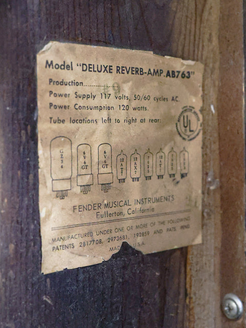  Label on a wooden door reads "Model Deluxe River Amp," representing the vintage 1965 Fender Deluxe Reverb combo.