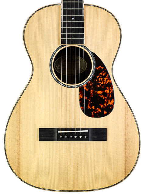Larrivée 0-40R acoustic guitar from 2016, set on a plain white background for a minimalist look.
