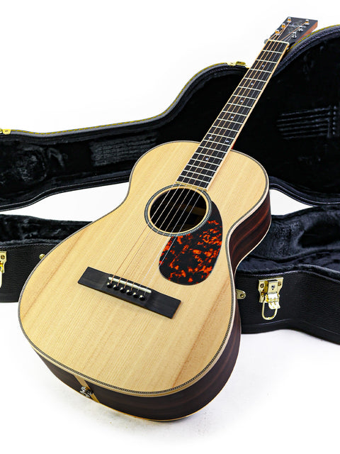 Larrivée 0-40R guitar in a case, highlighting its beautiful finish and quality, made in the USA in 2016.