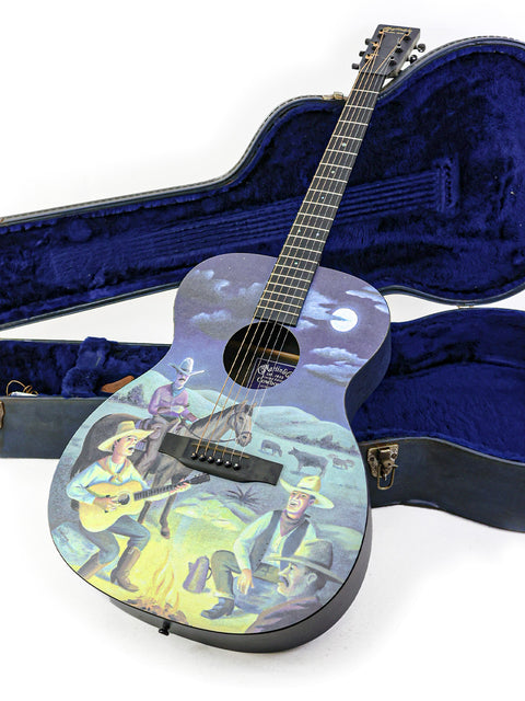 Limited Edition Martin Cowboy X guitar with a cowboy painting, numbered 74/250, crafted in the USA in 2000.