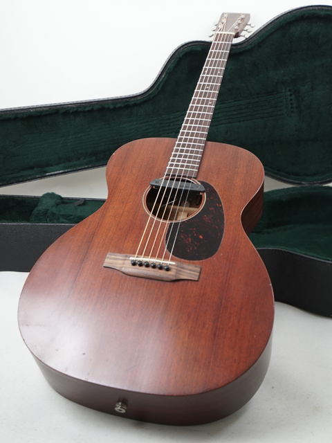 Martin Luther King Jr. holding a Martin 000-15M guitar, representing the power of music in the fight for civil rights.