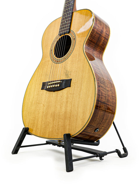 Matchless Lightning 15 Combo guitar on a stand, set against a clean white background, showcasing its classic design.
