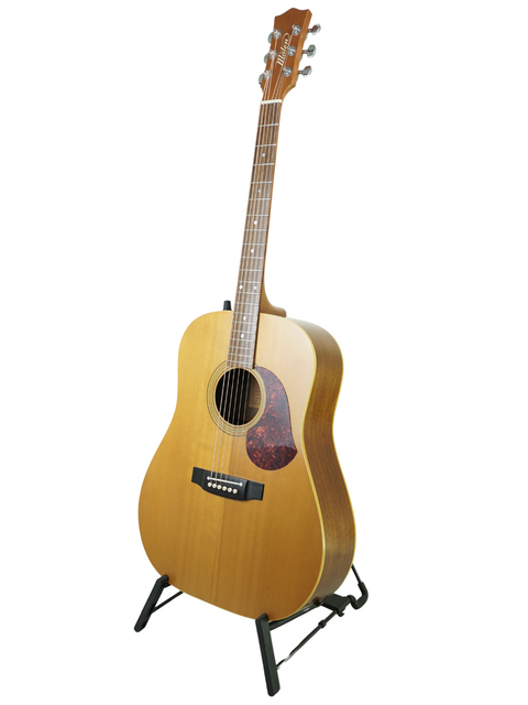 Maton EM300 guitar from 1991 displayed on a stand, set against a bright white backdrop.