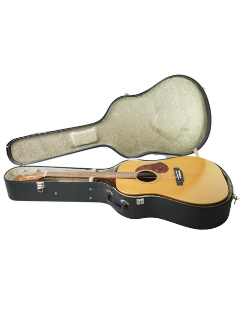 Maton EM300 guitar nestled inside a vintage case, showcasing its natural finish and classic design from 1991.