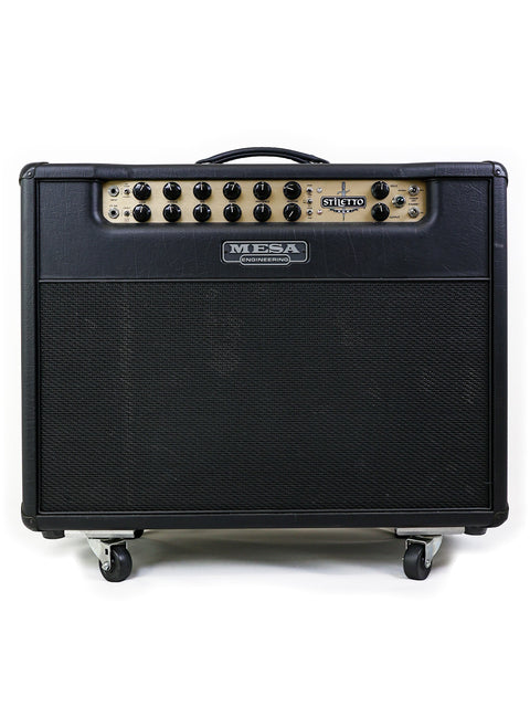 Mesa Boogie Stiletto Ace 2x12" combo amplifier in black and gold, mounted on wheels for easy transport and stylish performance.