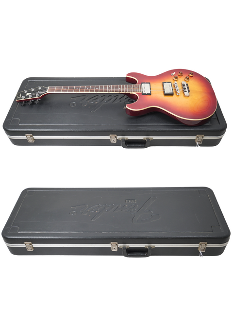 On a white background, two guitars in a case highlight a vintage Fender Esprit from Japan, made in 1984.