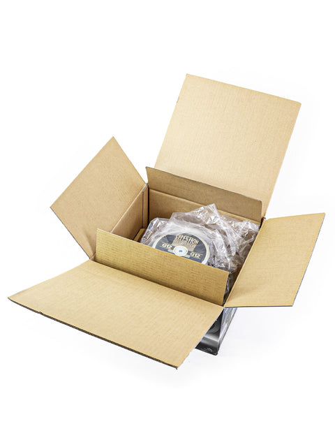 Open cardboard box with bubble-wrapped items inside on a white background.