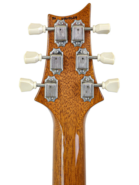 PRS McCarty Singlecut 594 electric guitar headstock, featuring a beautifully crafted wooden body and elegant design.