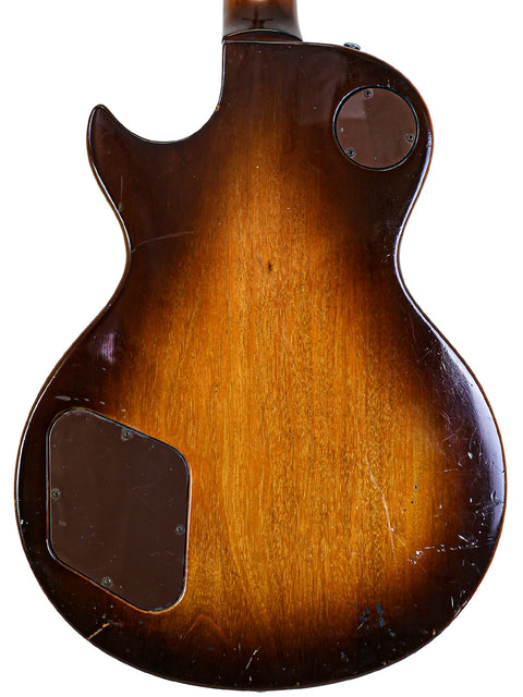 Rear perspective of a 1979 USA-made Gibson Les Paul Standard guitar featuring a brown finish.
