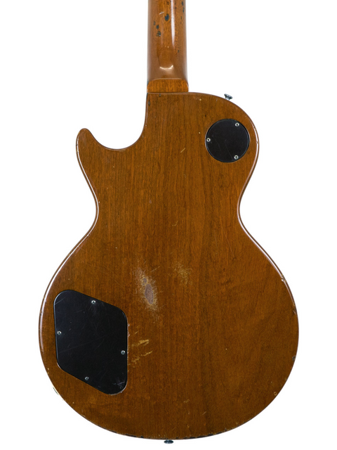 Rear perspective of a vintage Gibson Les Paul Standard Goldtop guitar, featuring a wooden body and narrow headstock from 1968.