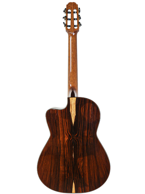 Rear view of a wooden acoustic guitar with a distinctive grain pattern, isolated on a white background.