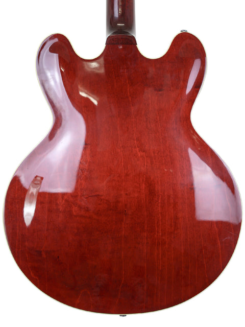 Red Gibson Custom Shop Trini Lopez guitar on a clean white background, showcasing its vibrant color and sleek design.