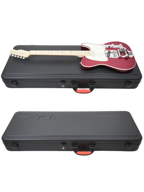 Red and white electric guitar on top of its black hard case, with another closed case below.