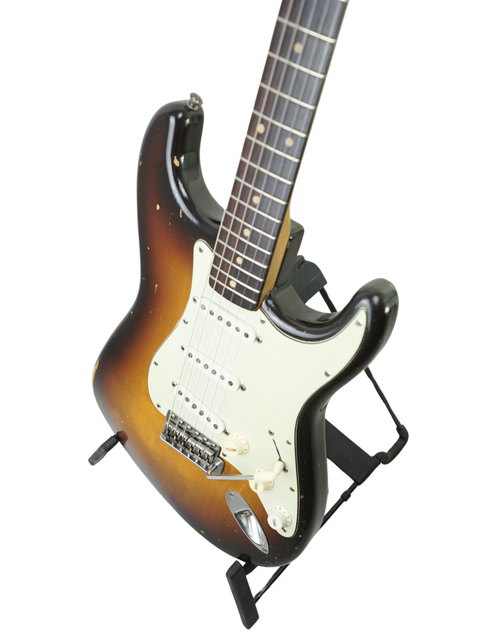Stunning 1959 Fender Stratocaster with a black body and sunburst finish, embodying vintage style and exceptional quality.