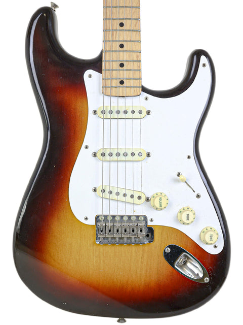 Stunning sunburst Fender Custom Shop Stratocaster, a vintage 1958 model, highlighting its iconic shape and rich tones.
