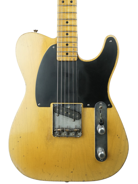 Stunning yellow 1961 Fender Telecaster, a true vintage gem that stands out with its iconic shape and rich history.