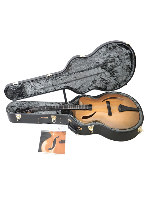 Stylish Hancock Phantom Custom Archtop guitar nestled in a protective case, perfect for musicians on the go.