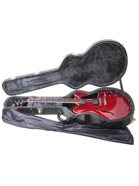Stylish red and black guitar case featuring a Gibson ES-335 Dot, crafted in the USA, 2006 edition.