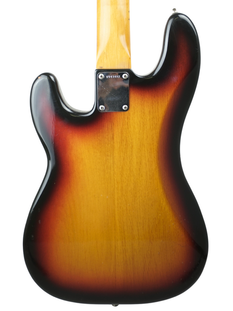 Sunburst electric guitar body with neck plate and serial number visible.