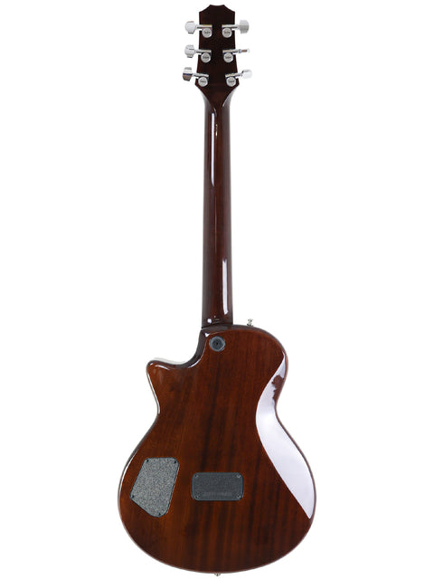 Taylor Solid Body guitar from 2007, featuring a stunning wooden body that highlights its natural beauty and design.